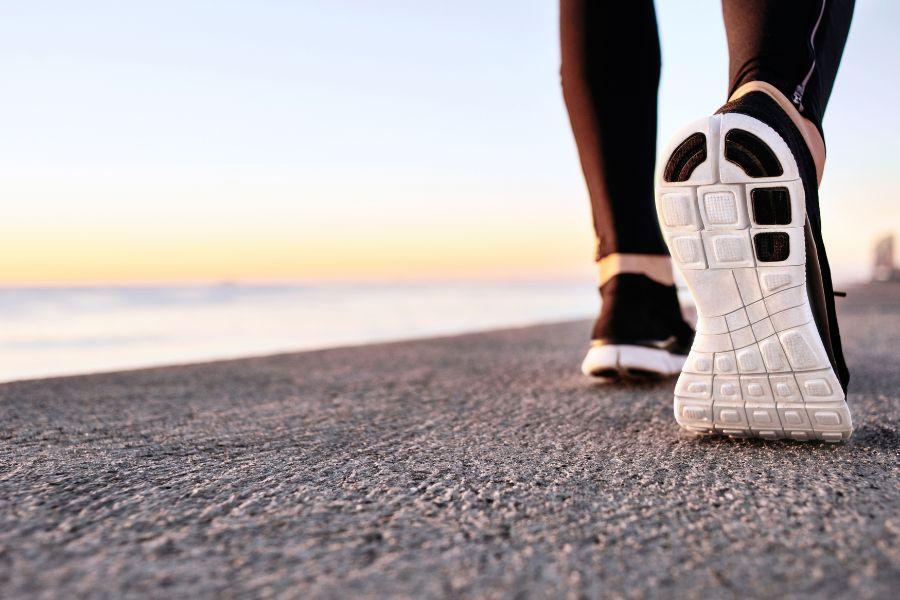 Walks on beach - image from shutterstock